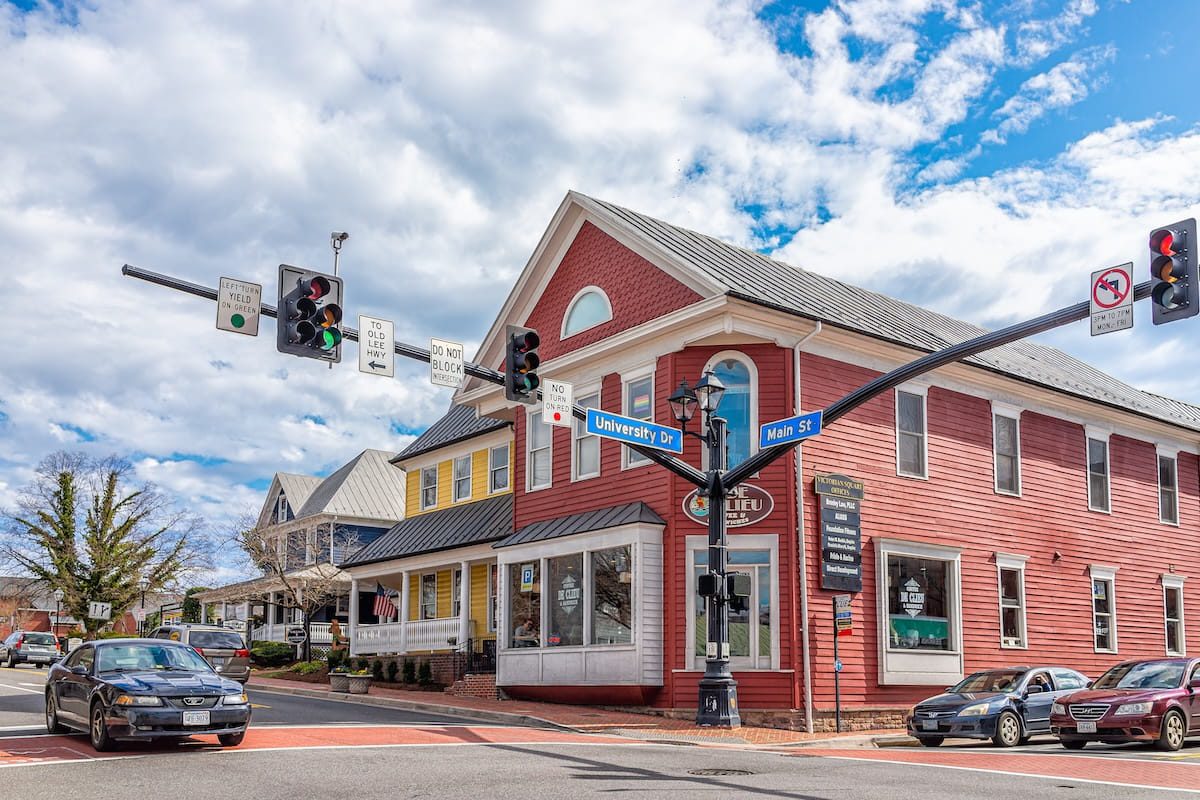 City of Fairfax, USA - March 10, 2020: Old town downtown at University drive, Main street intersection with stores shops and restaurants in Fairfax county northern Virginia