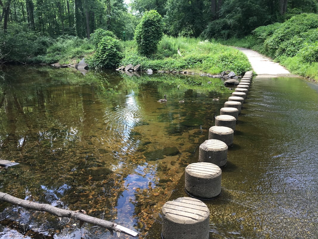 City of Fairfax, USA - March 10, 2020: Old town downtown at University drive, Main street intersection with stores shops and restaurants in Fairfax county northern Virginia