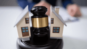 Judge Striking Gavel Between Split House